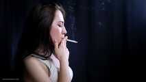 Brunette teen is smoking cork 100mm cigarette