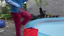 Watching sexy Sandra swimming in the swimming pool and lolling in the sun wearing a sexy blue shiny nylon rain jacket and a red rain pant (Video)