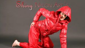Petra posing in a studio wearing a supersexy red rainwear combination (Pics)