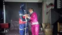 SEXY RONJA being tied and gagged and hooded from Sexy Stella both wearing sexy shiny nylon rainwear (Video) 