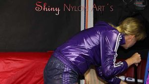 Watching sexy Pia wearing a sexy blue/purple shiny nylon shorts and a purple rain jacket dusting the studio (Pics)