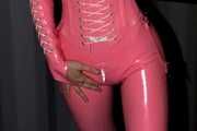 A babypink latex catsuit with Emma and a wet diaper inside