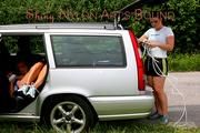 An archive girl tied, gagged and kidnaped by another archive girl by car wearing shiny nylon shorts (Pics)