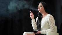 Watch lovely Tanya lighting up and smoking a 120mm Cigaronne