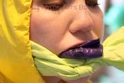 Jill tied, gagged and hooded on a stairway wearing a sexy shiny yellow rainwear combination (Pics)