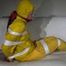 Watching Pia wearing a sexy yellow rainwear being tied and gagged with tape and a ballgag on a sofa (Video)