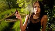 18 years old Tanya is smoking 120mm cork cigarette outdoors