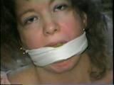 25 YR OLD CHARLENE HAS RAG & SPONGE STUFFED IN MOUTH, CLEAVE & ACE BANDAGE GAGGED, BLINDFOLDED & BALL-TIED (D39-2)