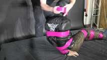 Marie M bound and gagged in shiny nylon Downwear trying to escape