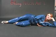 Beautiful archive girl posing in a photostudio wearing a supersexy AGU shiny nylon bib and rain jacket (Pics)