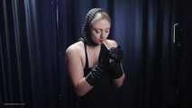 Blonde is smoking in a black leather gloves