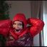 Jill ties, gagges and hoodes herself with cuffs wearing a sexy red shiny nylon down jacket and rain pants (Video)