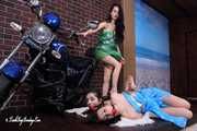 Lucky, Nelly, Xenia - Lucky poses on motorbike, two girls hogtied