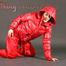 Petra posing in a studio wearing a supersexy red rainwear combination (Pics)
