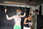 ***RONJA*** being tied and gagged overhead with ropes and a special combination of nylon over head and tape gagg from STELLA both wearing sexy shiny nylon shorts and tops (Pics)