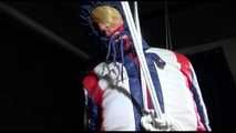 Sonja hanging tied, gagged and hooded with ropes on the ceiling wearing a supersexy oldschool down suit (Video)