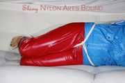 SEXY SANDRA being tied and gagged with ropes and a ballgag on a sofa wearing a SUPERSHINY NEW RED NYLON PANTS and a rain jacket (Pics)