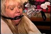 50 Yr OLD REAL ESTATE AGENT IS MOUTH STUFFED, BALL-GAGGED, HANDGAGGED, RING-GAGGED, GAG TALKING, BALL-TIED, BAREFOOT, TOE-TIED, AND LOTS OF TICKLING (D75-9)