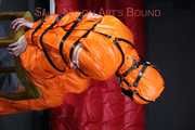 Sexy Pia being tied and gagged with belts a eye patch and a ballgag on a chair wearing a supersexy oldschool orange rainsuit (Pics)