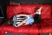 Watching ***PIA*** wearing a sexy lightblue shiny nylon shorts over a black leggings and a black/white striped top being tied and gagged with ropes and a clothgag (Pics)