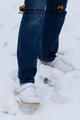 Linda with white clogs in the snow