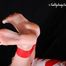 [From archive] Gatiita is mummified topless in red and white tape and hog taped