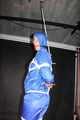 Watching sexy Pia being tied and gagged overhead with ropes and a ballgag wearing a supersexy blue shiny nylon bib overall and a rain jacket (Pics)