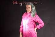 Mara wearing a sexy pink rainsuit posing infront of the camera in a studio (Pics)