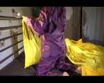 Lucy wearing a purple rain suit preparing her bed cloths for enjoying herself and the rain suit in bed lolling around (Video)