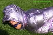 Watch Sandra beeing bound and gagged in her shiny nylon Downwear in the Garden