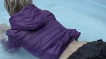 Watching sexy Sonja wearing a sexy shiny nylon rain pant and a purple down jacket enjoying the water in the swimming pool (Video)