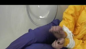 03:40 Min. video with Julia tied and gagged in a yellow downjacket and rainpants in a bathtube