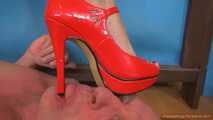 Dalia's tower high-heels on the poor slave
