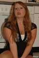 Chubby redhead  Benita stripping out of her black dress in the kitchen