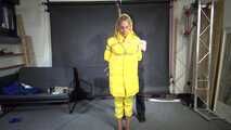 Ms Ungeniert tied, gagged and hooded in shiny nylon yellow Downjacket