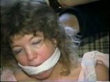 25 YR OLD CHARLENE HAS RAG & SPONGE STUFFED IN MOUTH, CLEAVE & ACE BANDAGE GAGGED, BLINDFOLDED & BALL-TIED (D39-2)