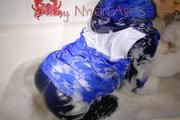 Watching Sonja taking a foam bath  wearing sexy blue shiny nylon rainwear (Pics)