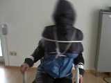 5 short Videos with Katharina tied and gagged in shiny nylon rainwear from 2005-2008