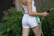 Watching sexy Sonja wearing white shiny nylon shorts and a top during watering the garden (Pisc)
