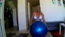  blue bouncy ball ridden off in a bikini