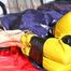 Sonja tied with tape and gagged with a ball gag on the bed wearing an oldschool yellow rainsuit (Pics)
