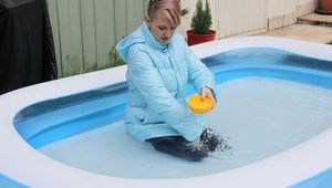 Mara in our little swimming pool wearing sexy shiny downwear (Pics)