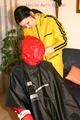 Jill tied, gagged and double hooded on a chair by an archive girl both wearing shiny rainwear (Pics)