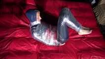 Sexy Sonja wearing an oldschool rainwear suit being tied and gagged with plastic wrap (Video)