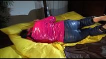 Lucy tied and gagged on a pillory on a bed wearing a supersexy crazy sensation downwear (Video)