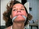 28 YR OLD MOM GETS MOUTH STUFFED WITH SPONGE, CLEAVE GAGGED,  HANDGAGGED, ROPE GAGGED, TIT TIED BAREFOOT, & TOE-TIED (D62-9)