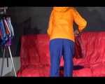 Lucy wearing a sexy blue shiny nylon pants and an orange rain jacket while folding clothes (Video)