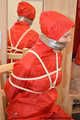 Bondage in  red nylon rainwear