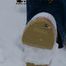 Linda with white clogs in the snow