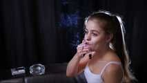 Lovely girl Irina enjoys the moment while smoking a cigarette